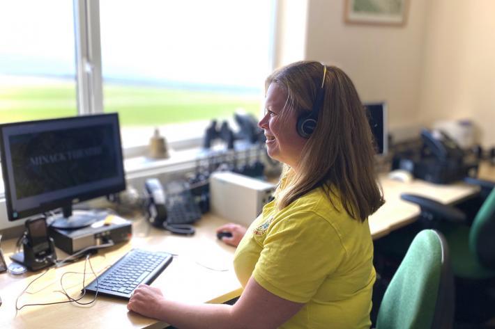 A member of the box office team helping a client by phone
