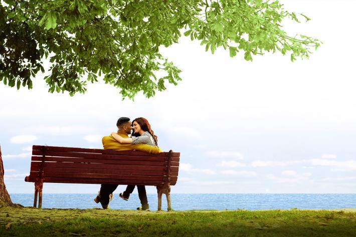 The Last Five Years - two young people cuddling on a bench 