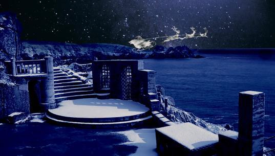 Snowy Minack with Santa flying overhead